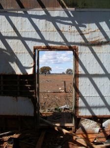 the outback through the doorway of the old homestead